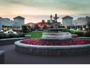 alt="A sunny day at the open-air Waugh Chapel Towne Centre in Odenton, MD, a local shopping and dining hub."