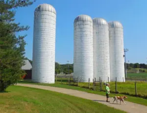 alt="A historic tractor on display at the working farm in Kinder Farm Park, a 288-acre landmark in Severna Park, MD."