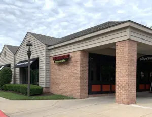 alt="A plate of famous baby back ribs from The Corner Stable, a beloved family-friendly restaurant in Columbia, MD."