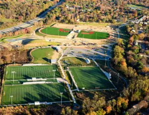 alt="Children playing on the unique and modern playground structures at Blandair Regional Park in Columbia, MD."