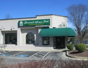 alt="The classic and welcoming sign for the Stained Glass Pub, a long-standing local favorite in Elkridge, MD."