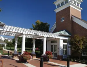 alt="The beautiful clubhouse at the Maple Lawn Community Center in Fulton, MD."