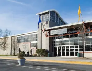 alt="Skaters on the ice at The Gardens Ice House, a premier ice skating facility in Laurel, MD."