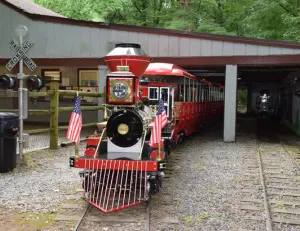 alt="Children playing on the miniature train ride at Cabin John Regional Park, a popular family attraction in Bethesda, MD."