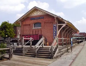 lt="The historic 1884 B&O Railroad Station that houses the Gaithersburg Community Museum in Maryland."