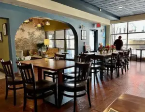 alt="The modern and inviting dining room of District Bistro, a popular American restaurant in Wheaton, MD."