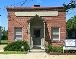alt="The historic Belair railroad station which houses the Old Town Bowie Welcome Center and Interactive Children’s Museum."