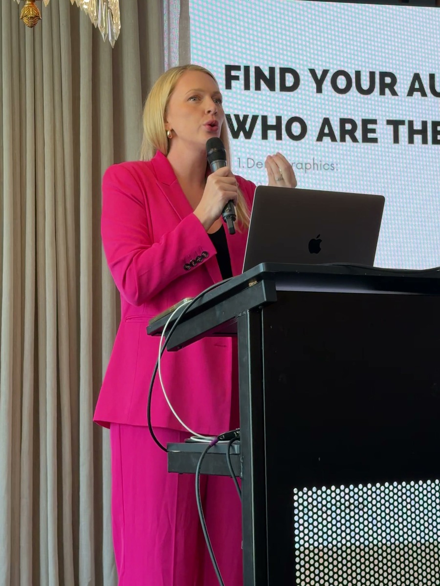 Alicia Hagen presenting at a lectern