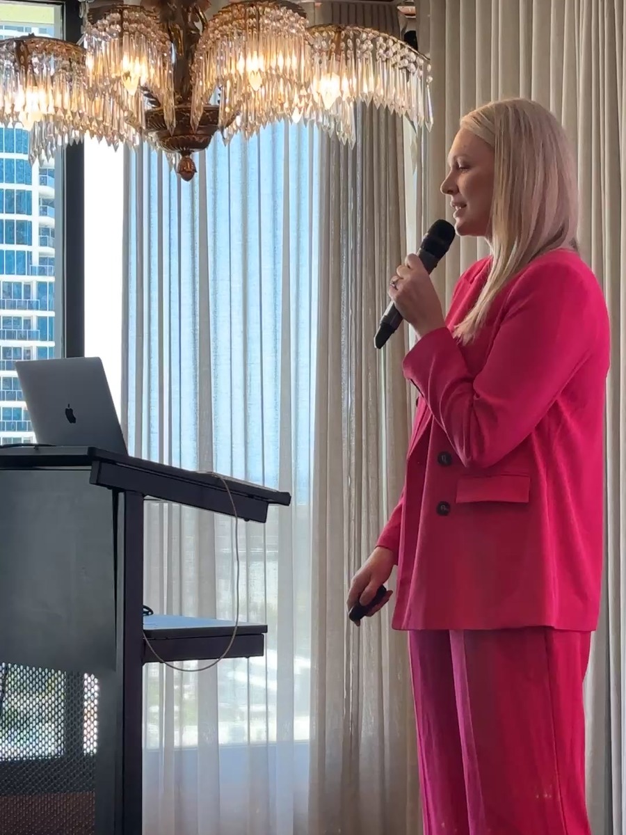 Alicia Hagen speaking to a conference room