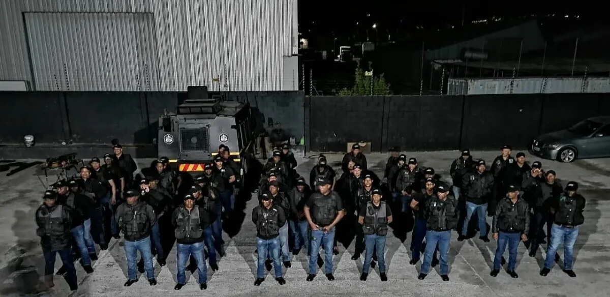 Elite security team assembled at night in operational yard