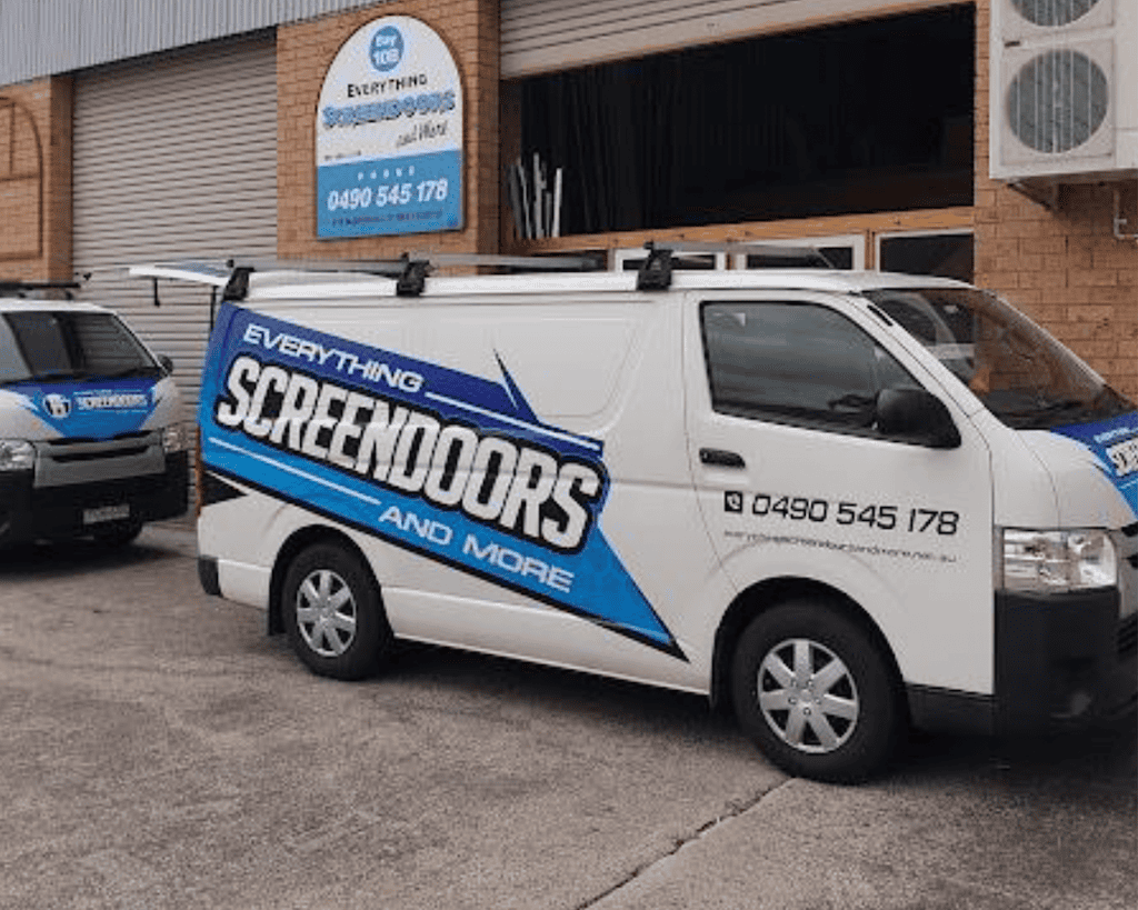 Screen door business vans outside the workshop