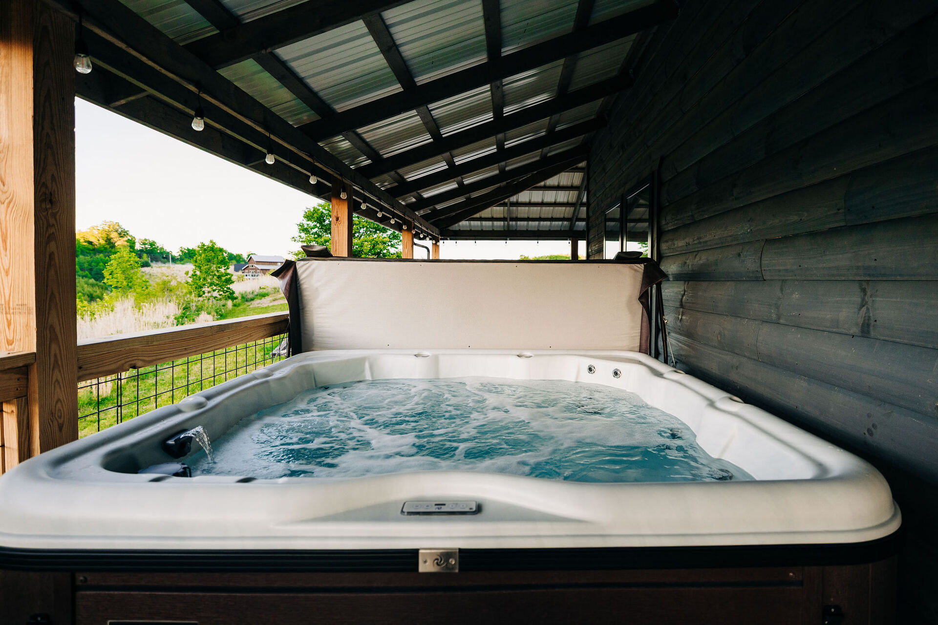 Covered hot tub on the deck at Greywood Reserve