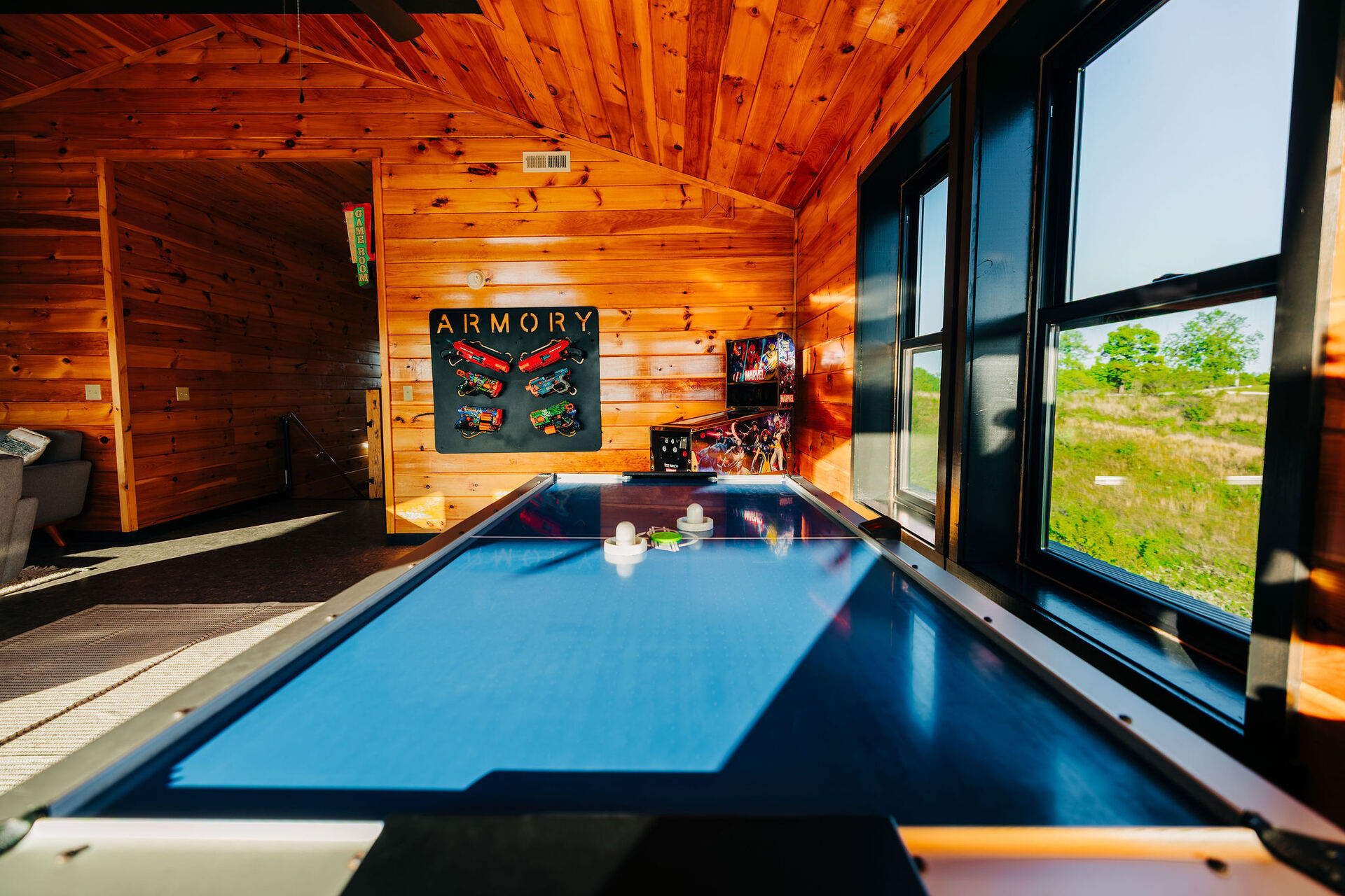Game room with pool table and arcade at Greywood Reserve