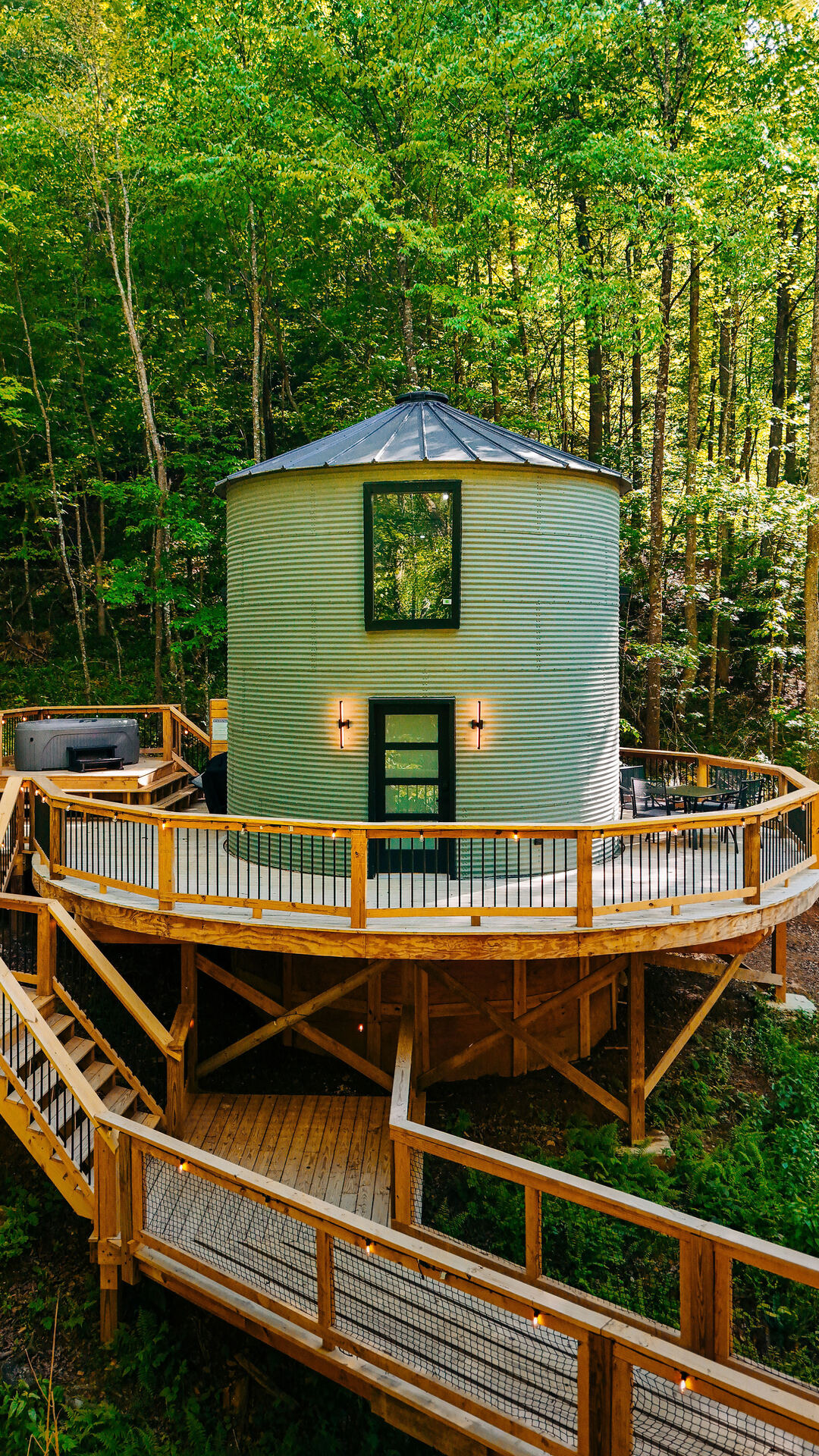 The Yoder — Romantic silo escape · string-light footbridge