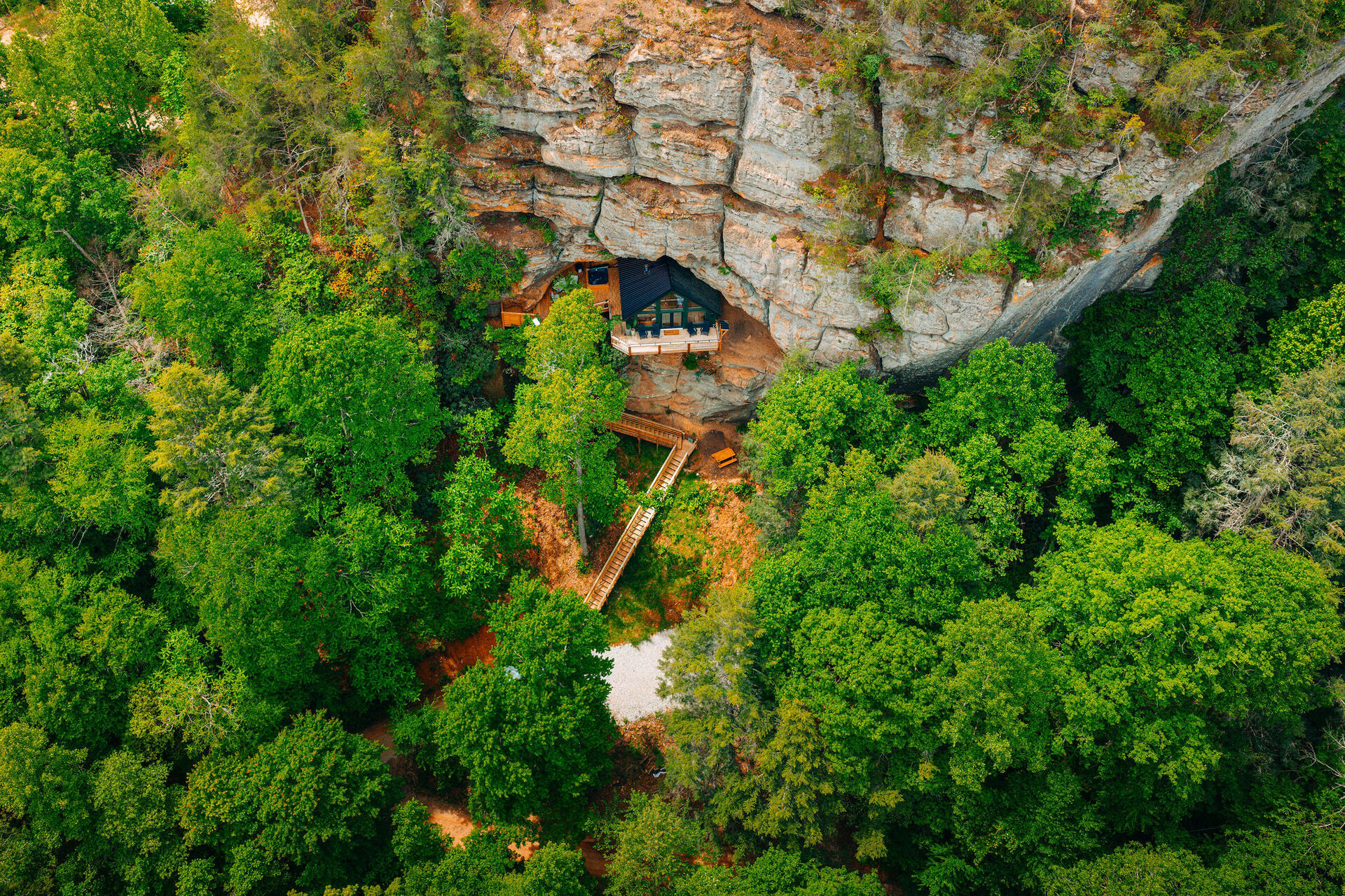 Rockface Retreat perched on a 75-foot sandstone cliff, seen from the air