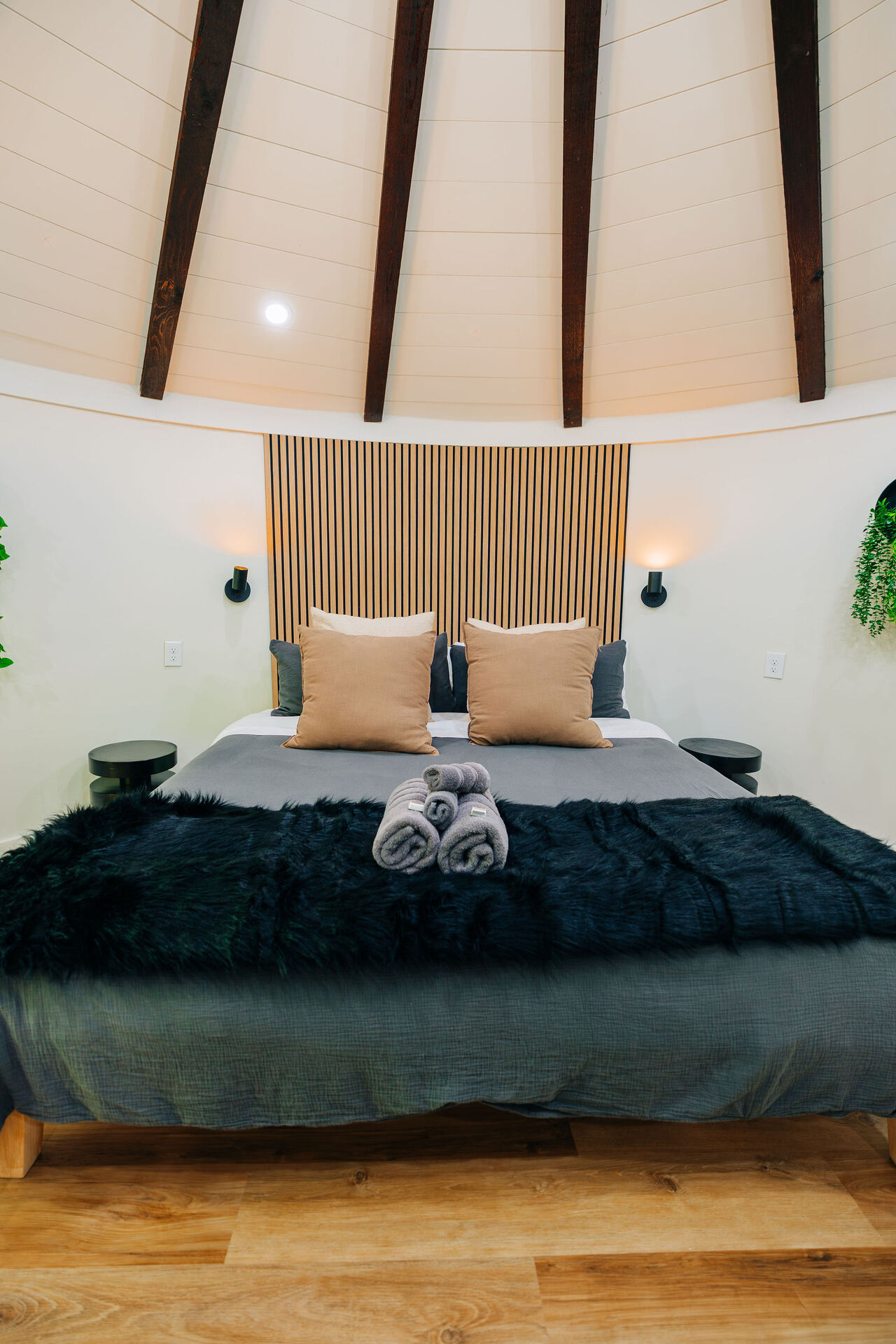 Bed beneath the silo's radial beam ceiling at The Yoder
