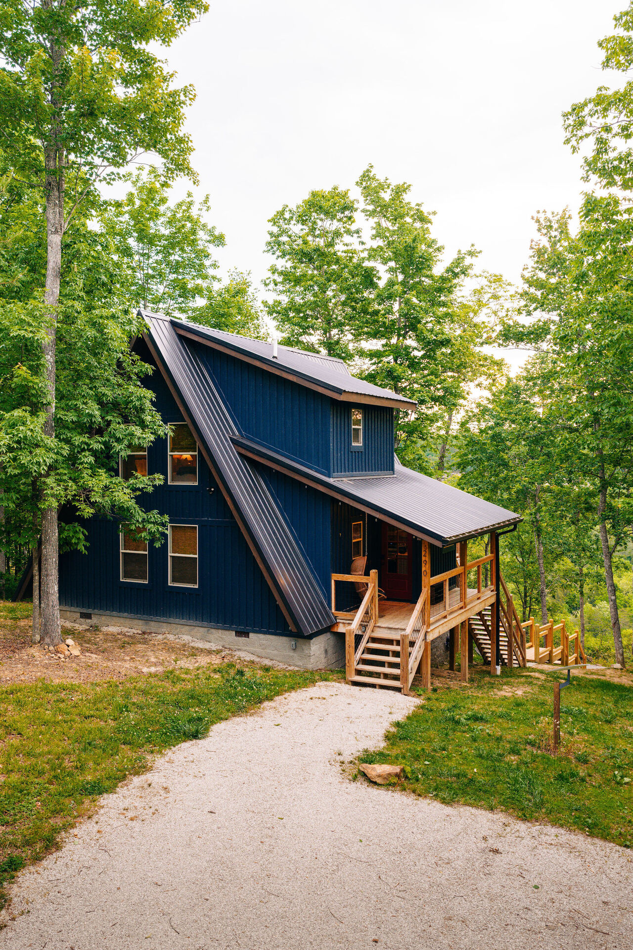 Limestone Ridge cabin glowing at dusk in the forest