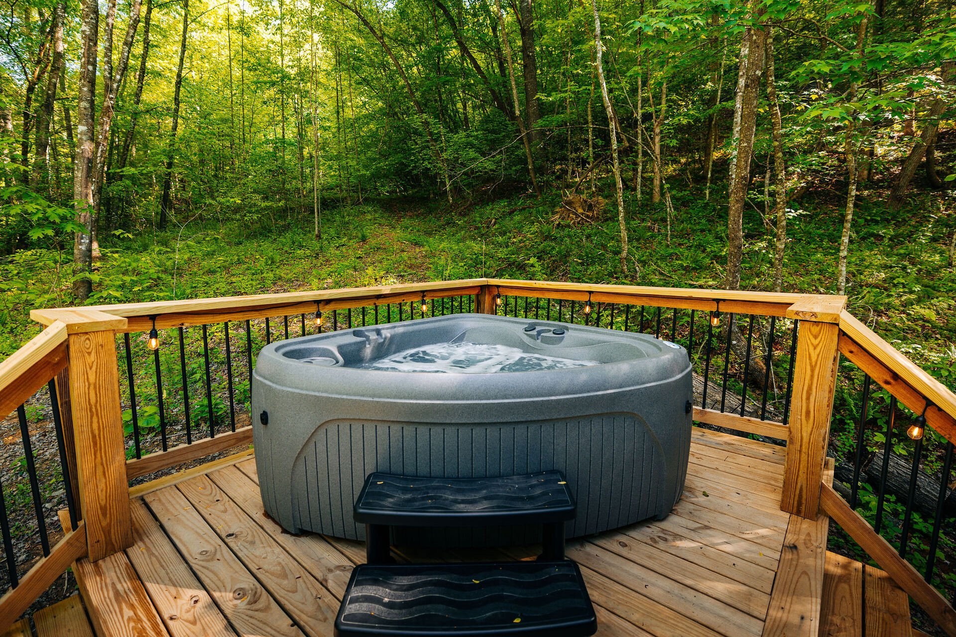 Private hot tub on The Yoder's deck overlooking the ravine