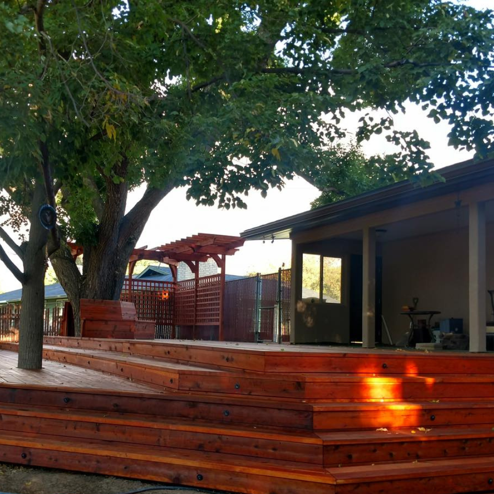 Deck and outdoor space features beautiful wood staining job,