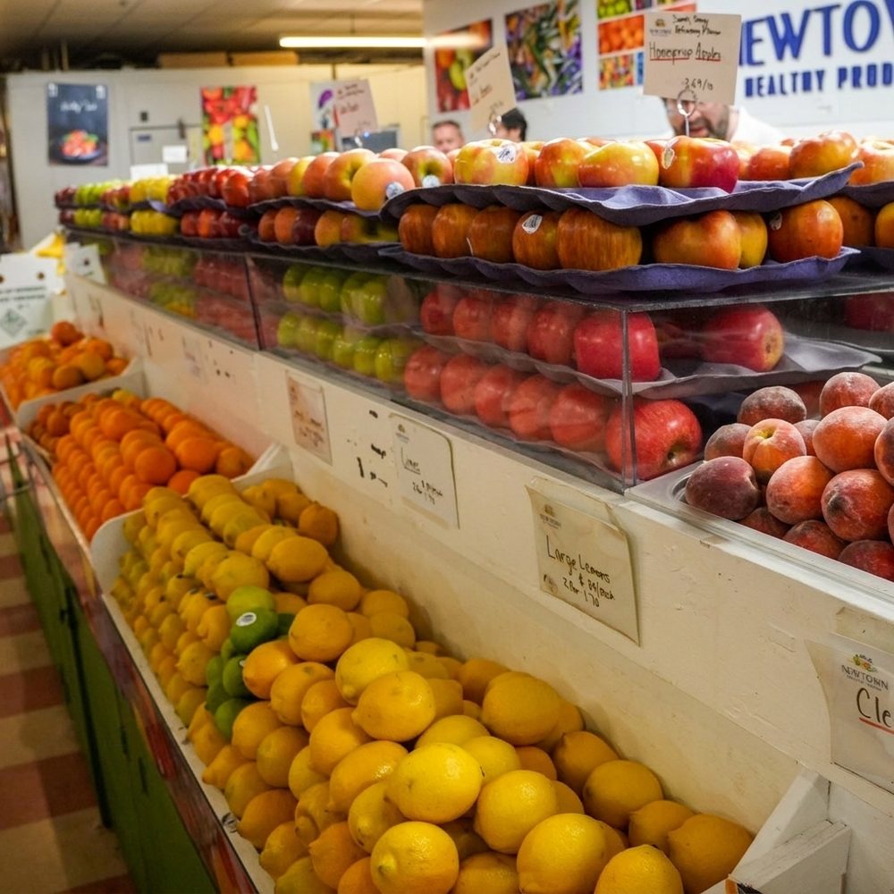 Apples, oranges and lemons stacked at the stand