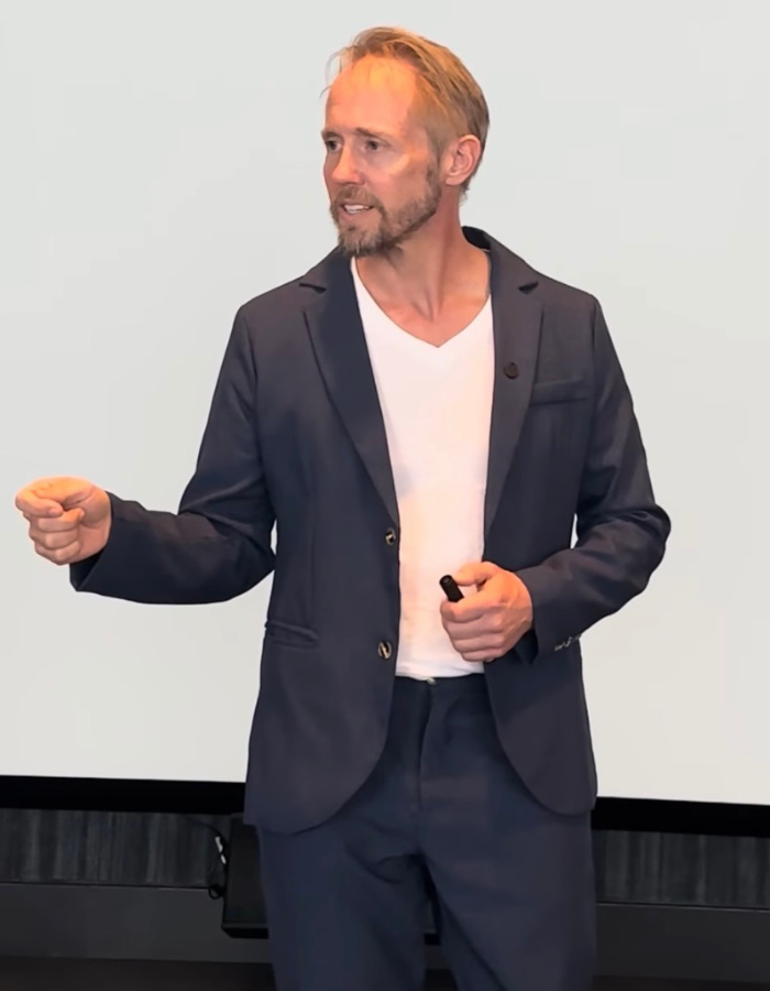 Stacey Frick speaking on stage