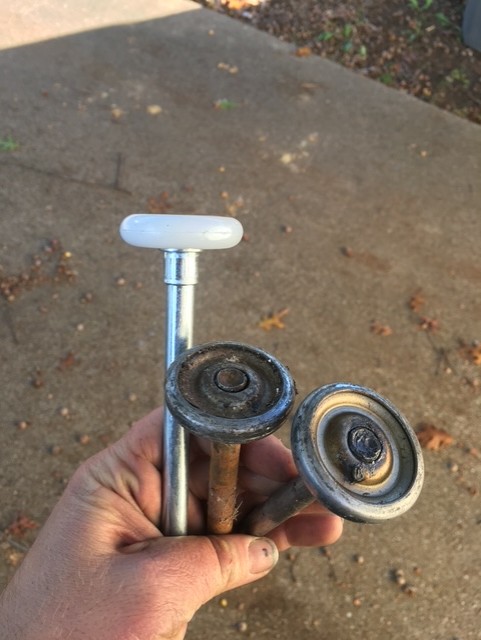 New garage door rollers installed to replace worn rollers
