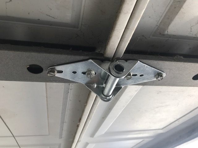 New hinges installed to replace broken garage door hardware