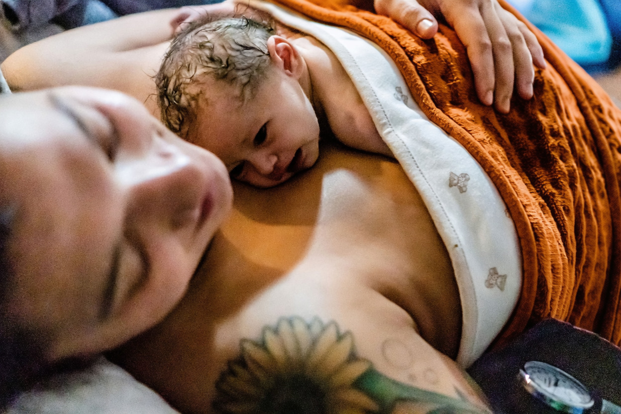 Tender skin-to-skin moment with a newborn