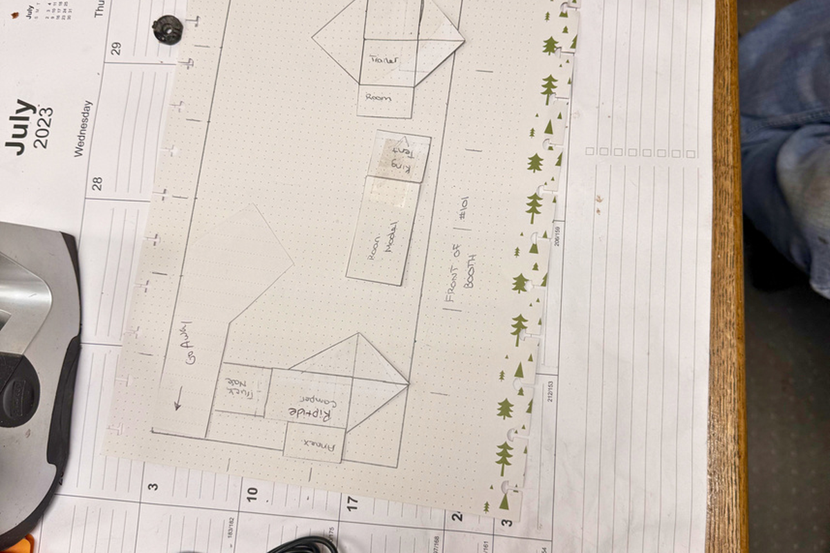 BundutecUSA truck camper and BunduTop displayed on a transport flatbed trailer at the 2026 S.A.V.E. Expo, showcasing the Free Camper and RipTide models as part of the Official Truck Camper Sponsor booth.