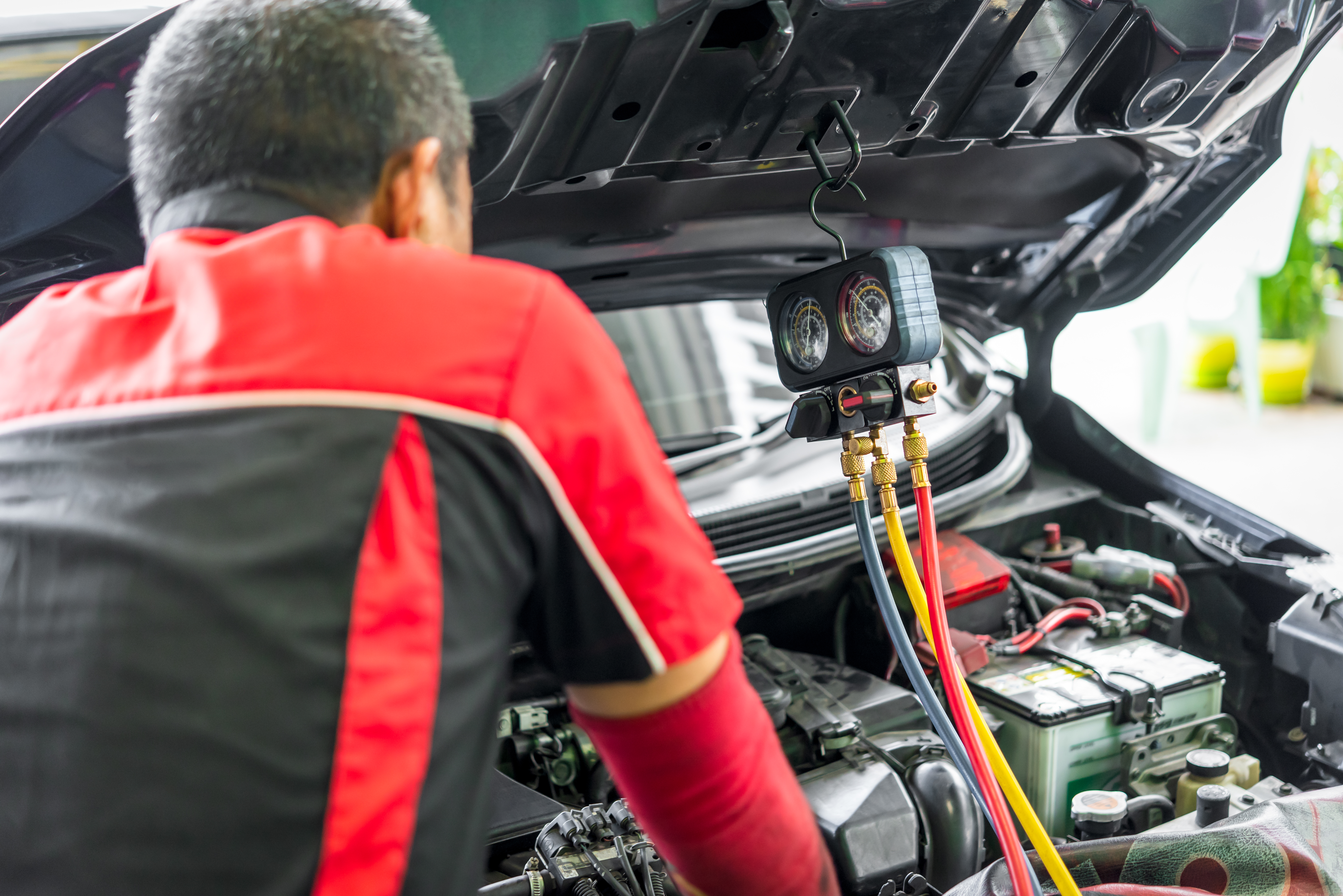 Technician performing AC repair