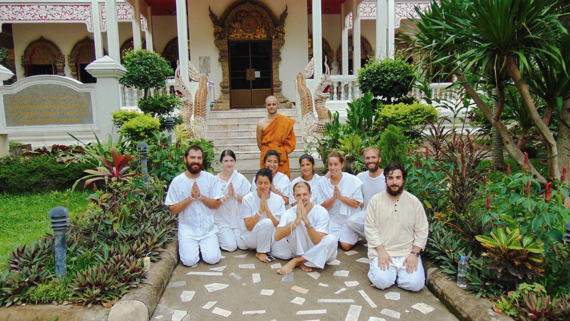 Group photo with monk at the Buddhist monastery