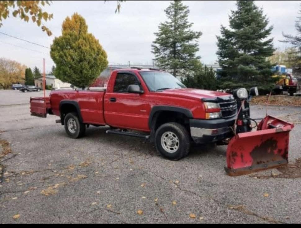 Lakehouse Lawn Care truck and equipment serving Six Lakes Michigan
