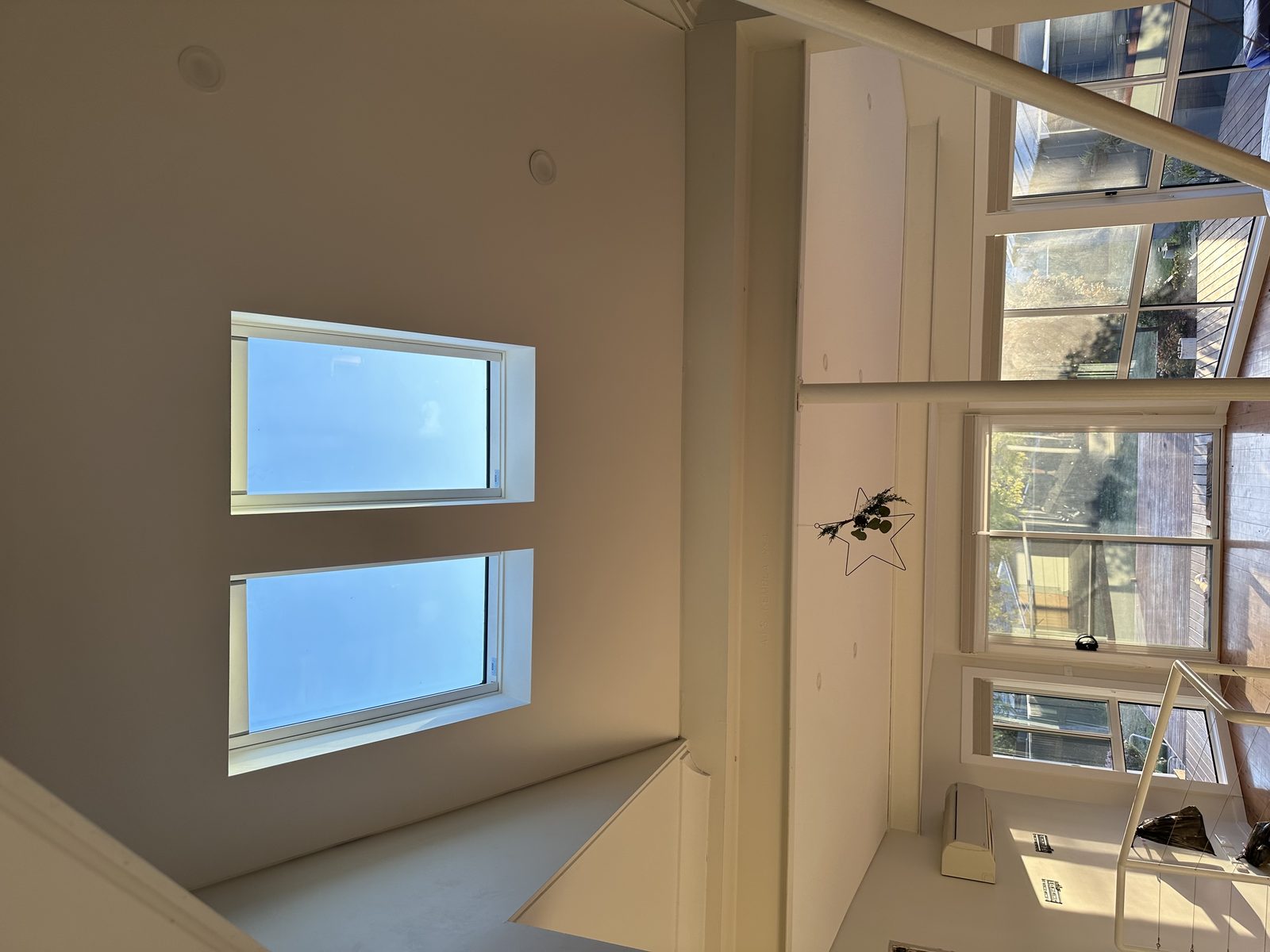 Pair of flat skylights in a high void ceiling