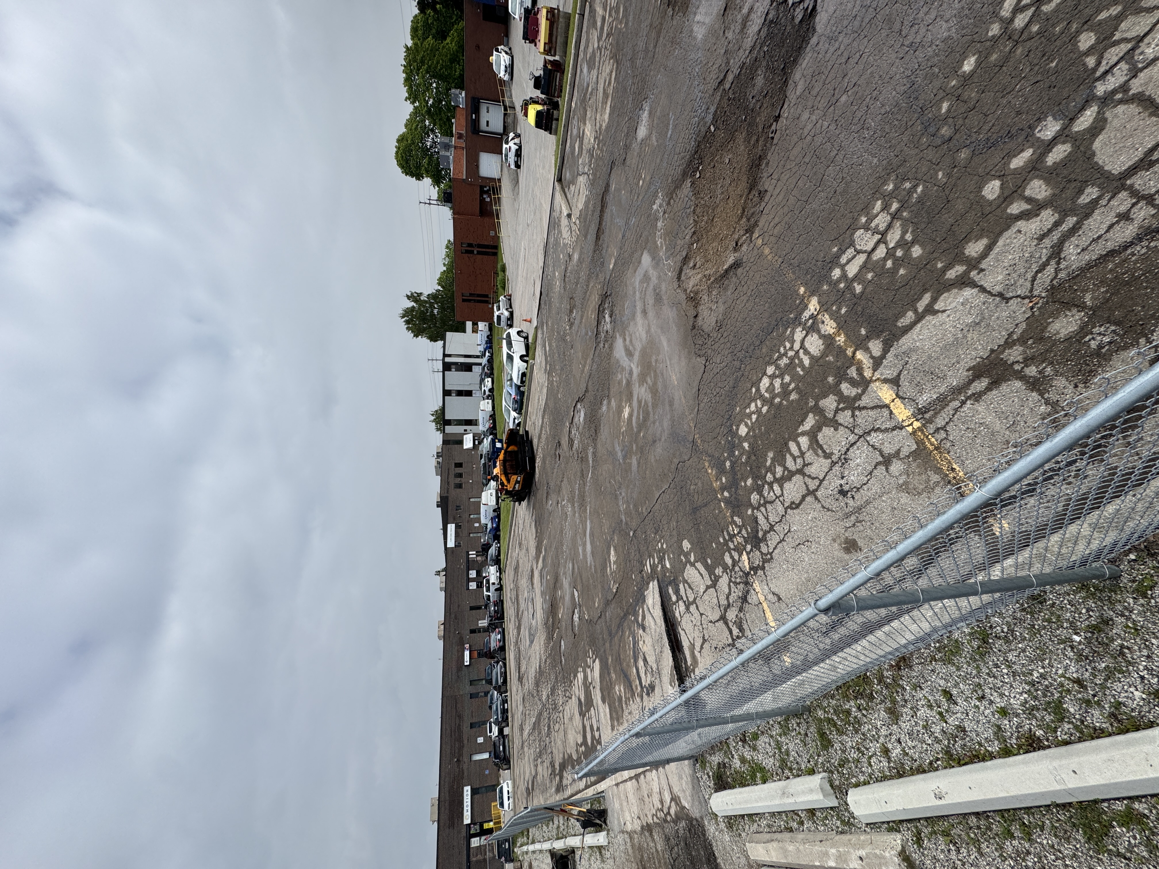 Broken Commercial Parking Lot in need of repair| Pavemar Paving
