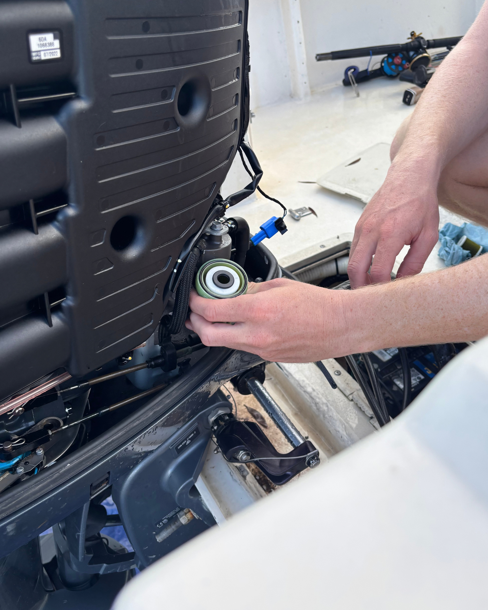 Outboard Pit Crew performing maintenance on an outboard engine
