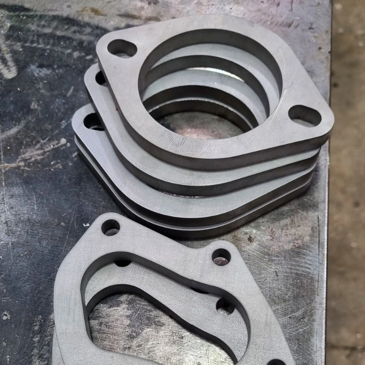 CNC waterjet cutting machine producing precise cuts in metal