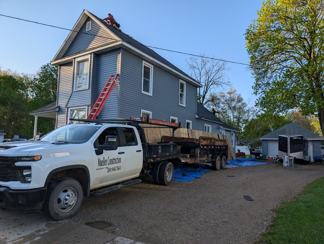 Close-up of finished roof shingles and flashing detail by Mueller Construction