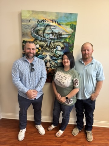 Louisiana homebuyers at closing with Bayou Mortgage