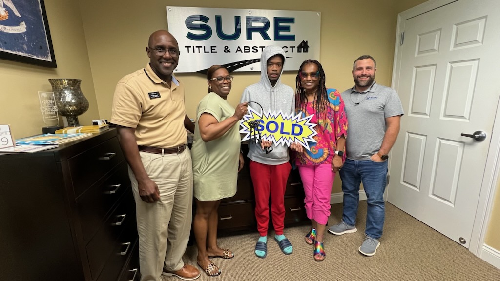 Clients at closing with Channing Moore