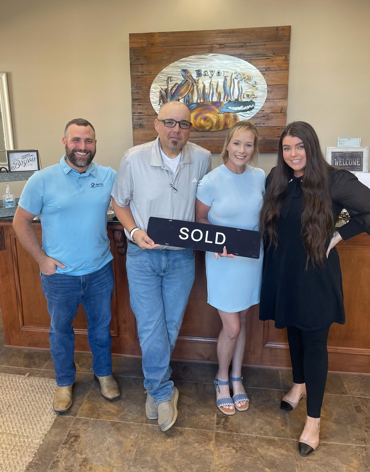 Homebuyers at closing with Channing and his team