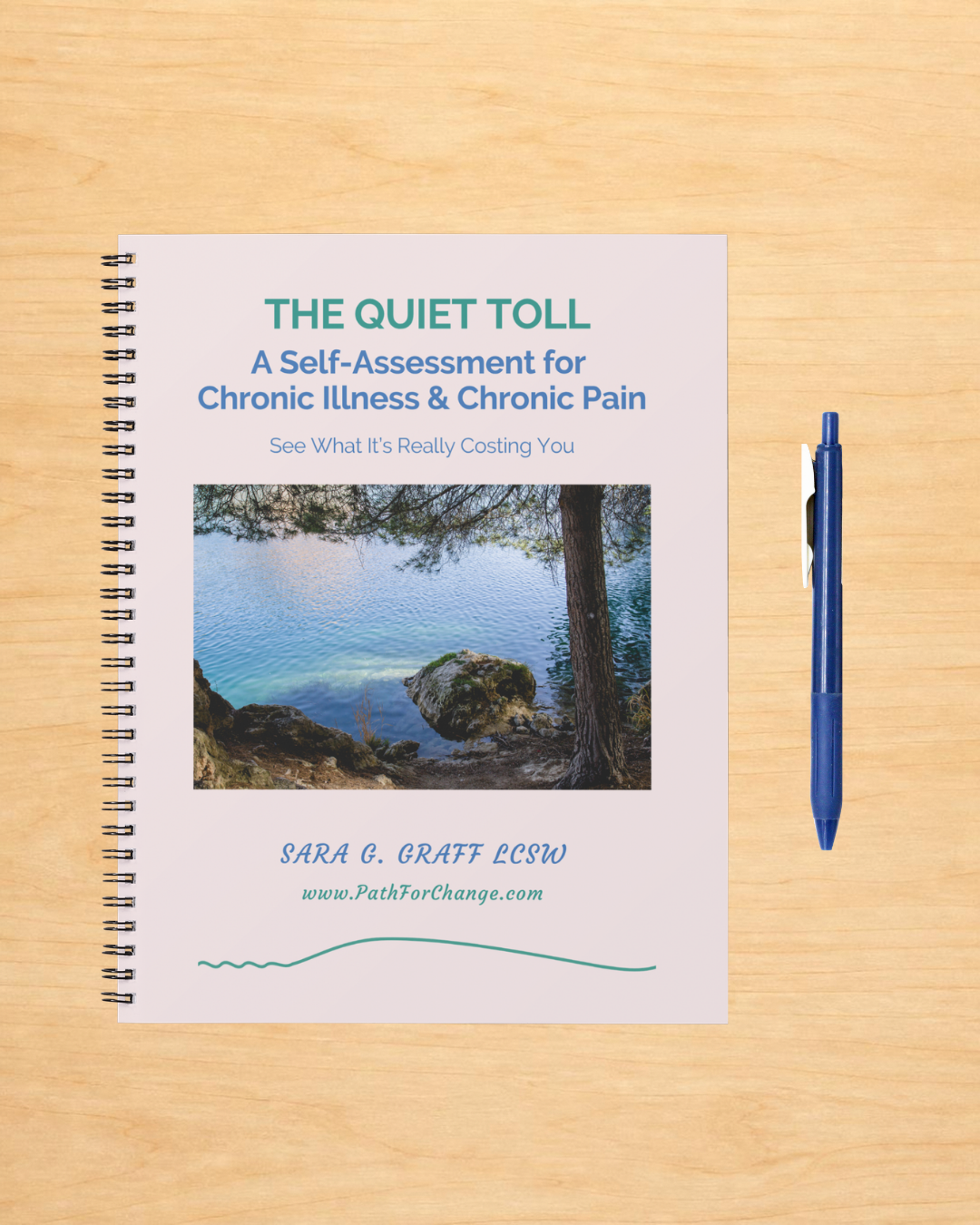 The Quiet Toll Self-assessment notebook with a blue pen