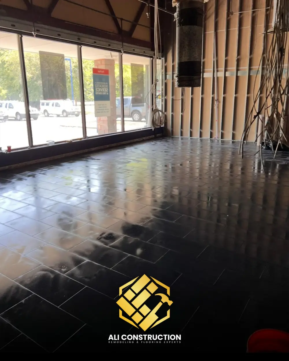 Large-format black tile floor — Ali Construction