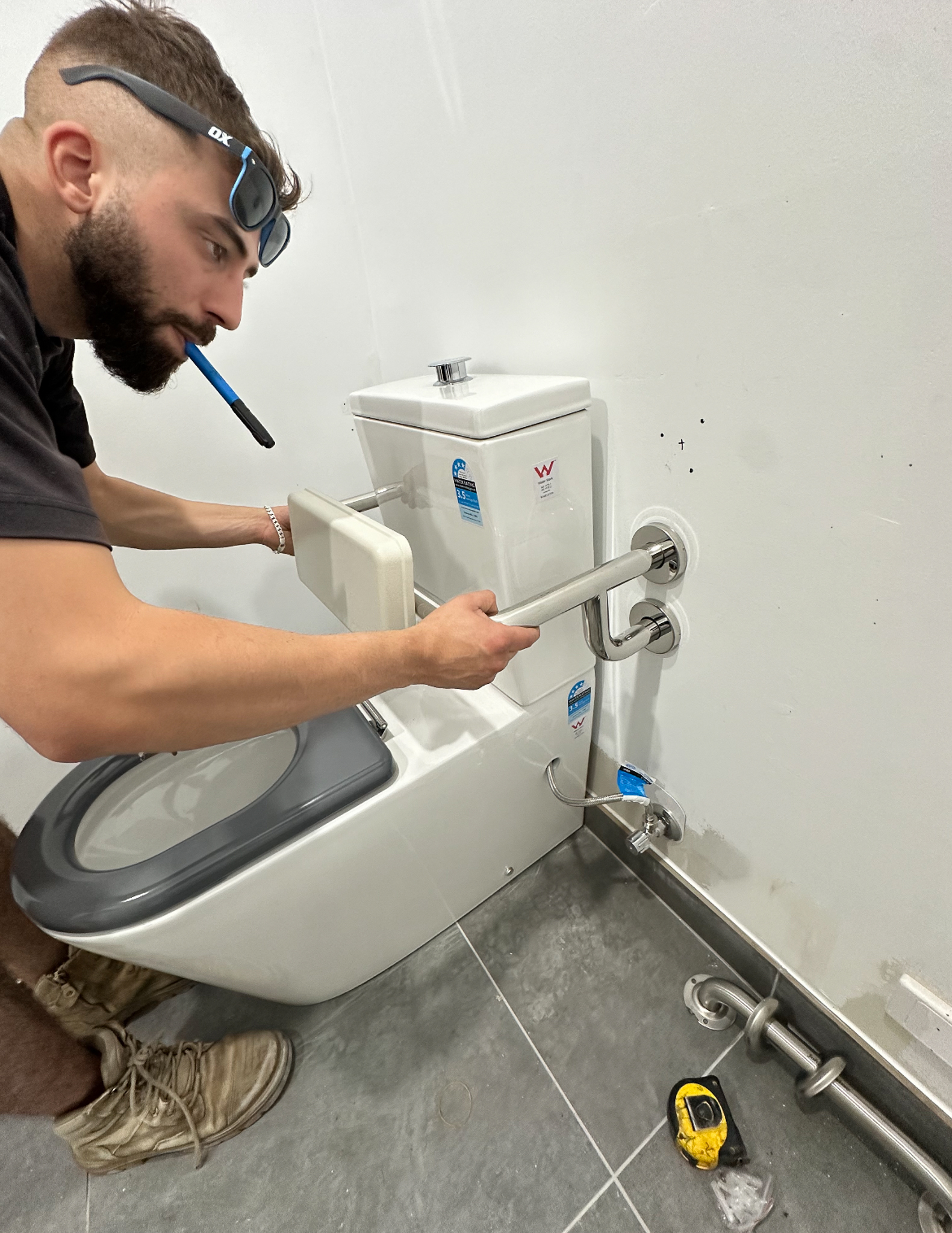 SPD Plumbing technician repairing a toilet