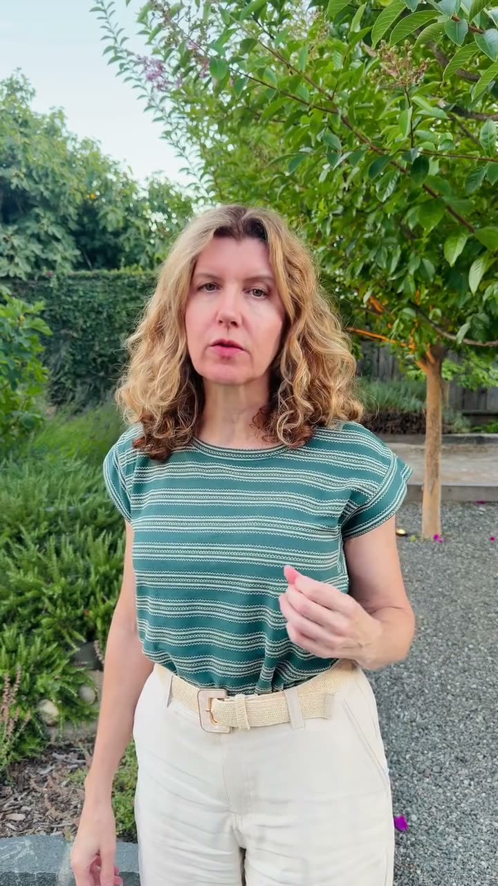 Tina, landscape designer, speaking to camera in a garden