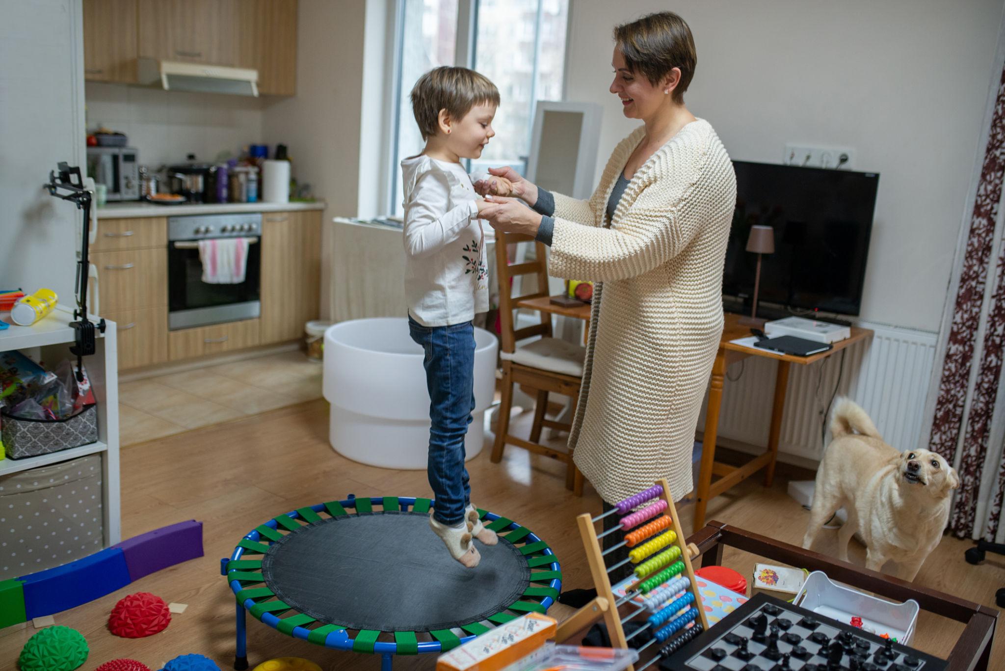 Speech and language therapy helping child with autism develop communication