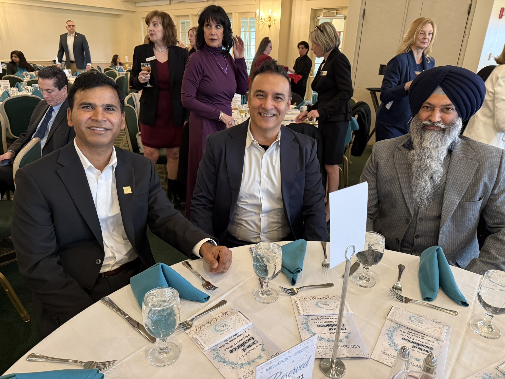 A group gathered at a real estate community event.