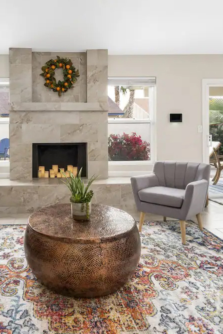 woman setting sheets on bed