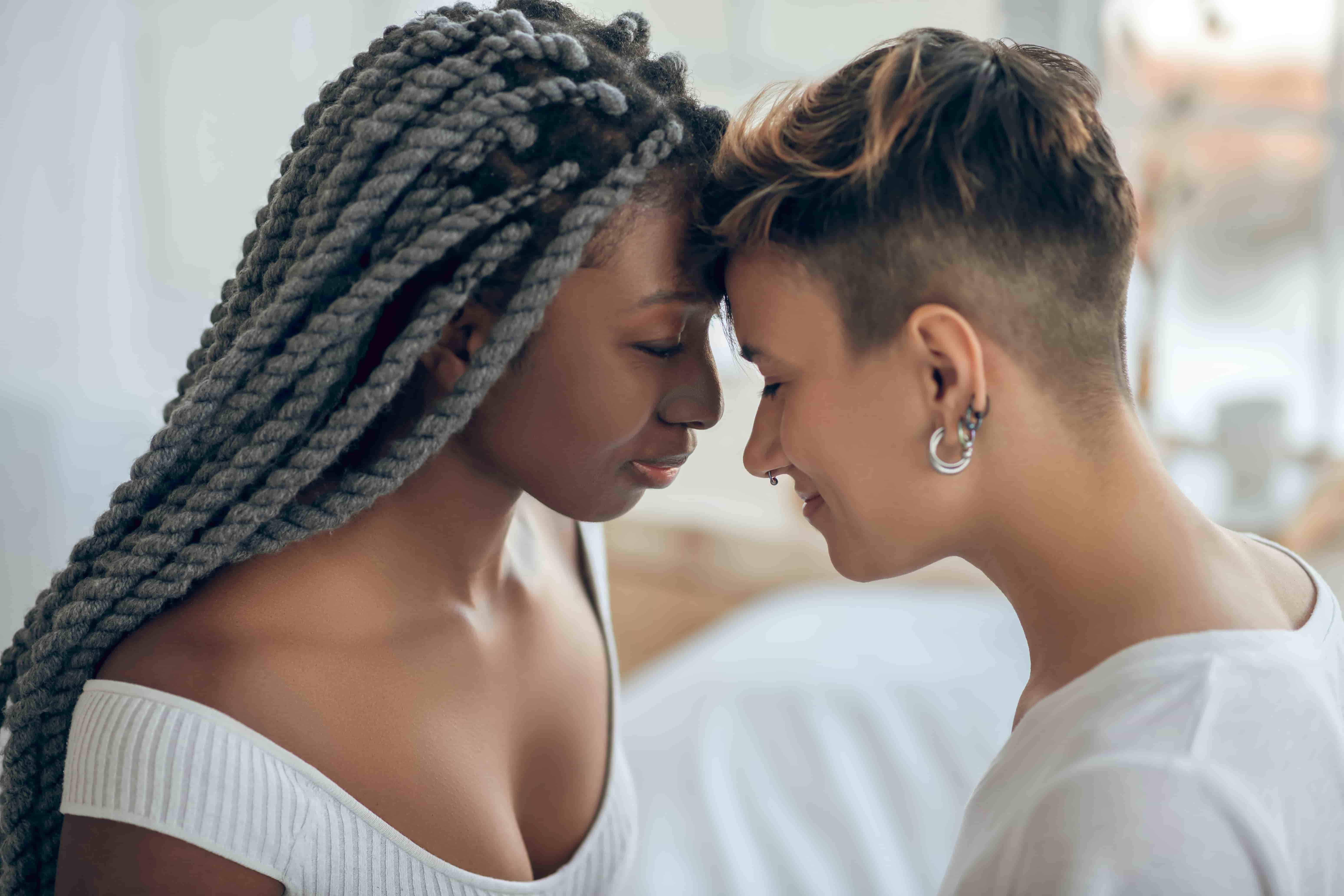 Intimate couple touching foreheads
