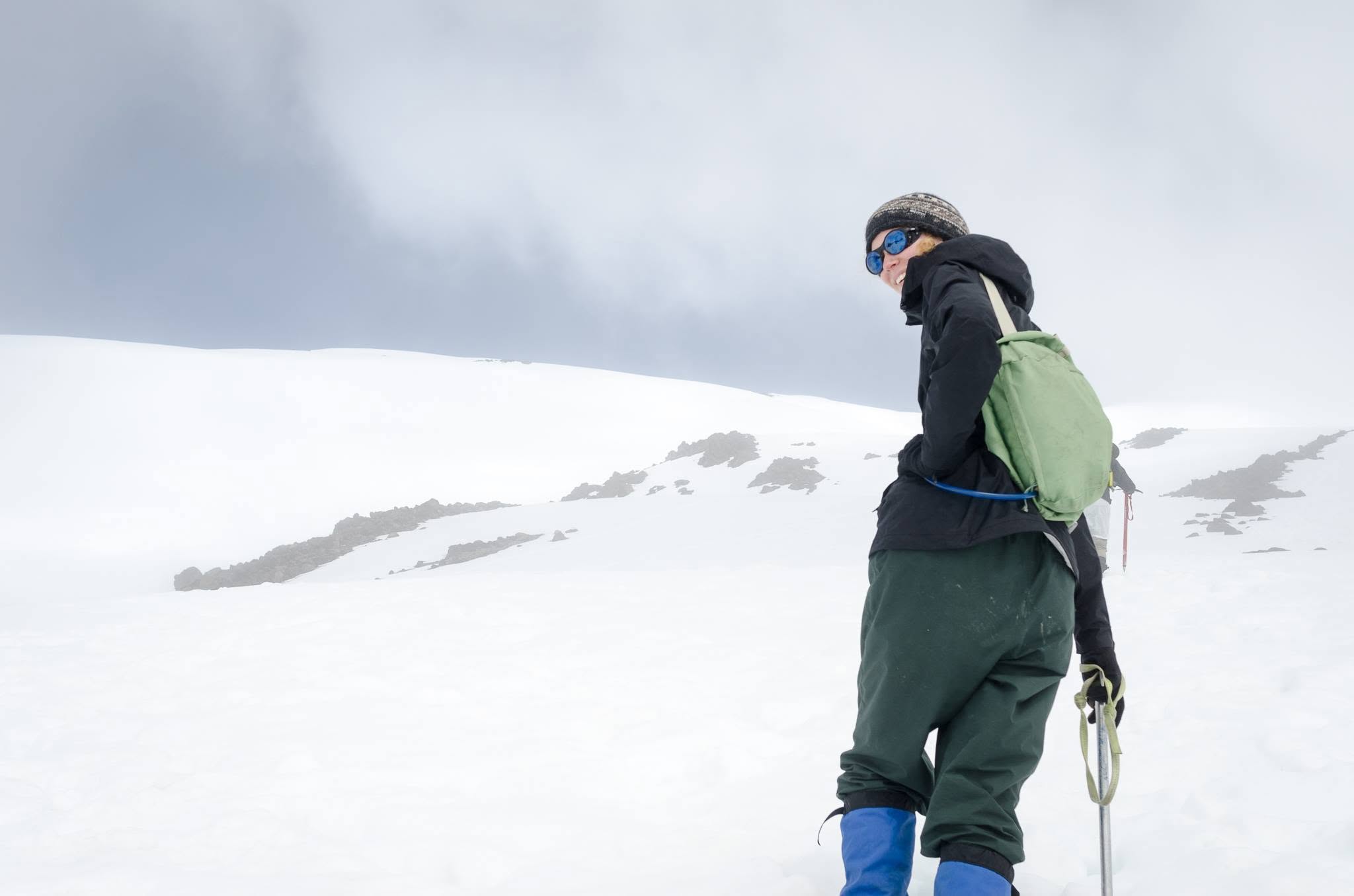 the author stands on the slope of a snowy mountain the author stands on the slope of a snowy mountain