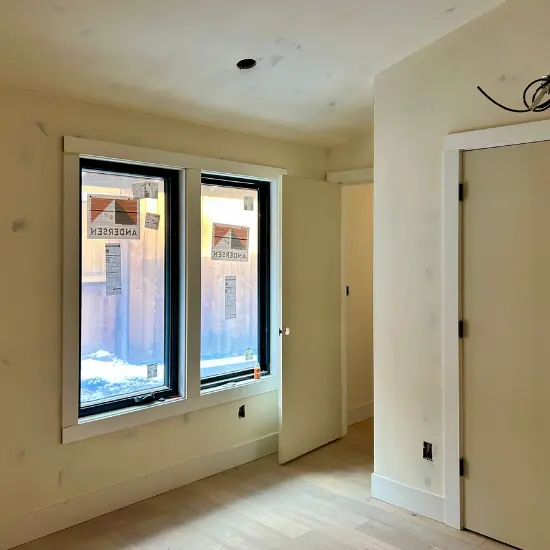 Bedroom of a newly built home before interior paint is done